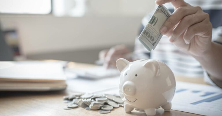 piggy bank and money on desk